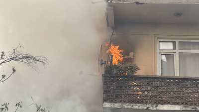 Yangında mahsur kalan görme engelliyi otopark görevlisi kurtardı